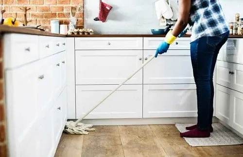 mom cleaning the kitchen and mopping