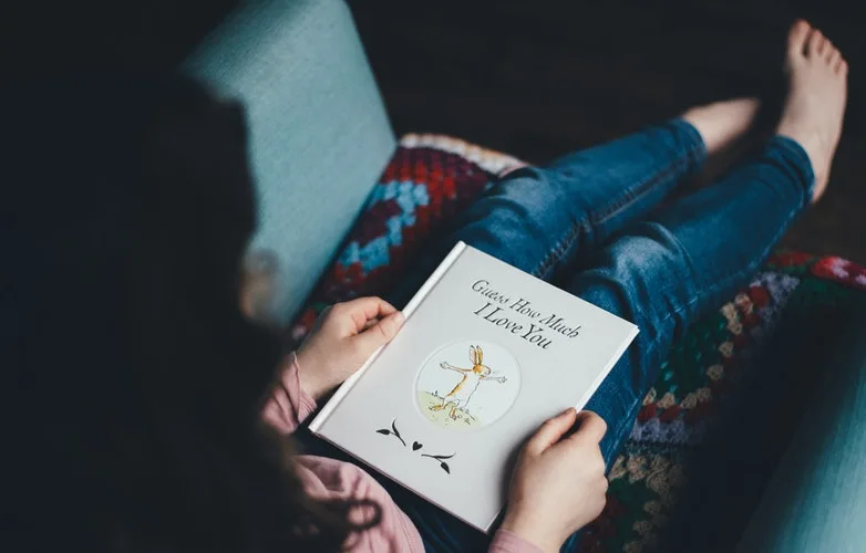 woman reading Easter books for kids