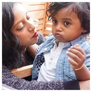 mom and toddler son bonding at restaurant date