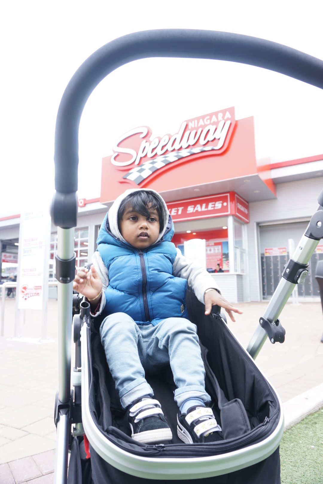 toddler boy watching races at the Niagara Falls Speed Way