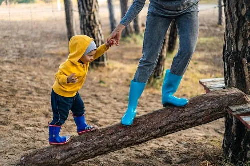 1 year old playing outdoors at park