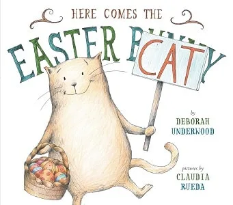 Here Comes the Easter Cat Book Cover with a cat holding a basket of Easter Eggs
