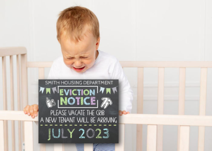 toddler boy crying in crib with eviction notice pregnancy announcement sign
