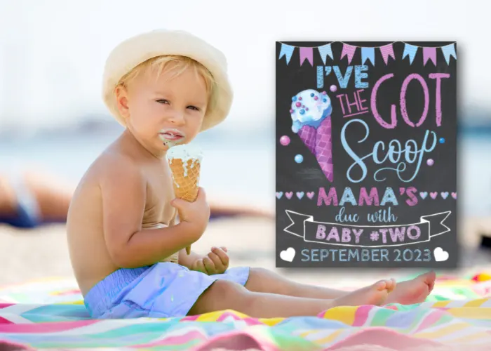 toddler boy eating ice cream next to ice cream big brother announcement sign