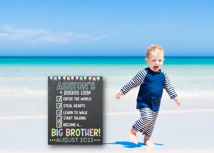 toddler boy running at the beach next to 'to do list' sibling announcement board