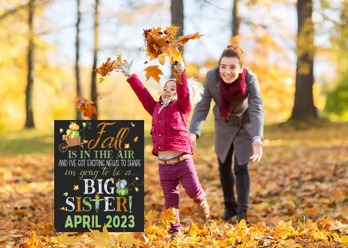 little girl throwing leaves next to fall big sister pregnancy announcement sign 