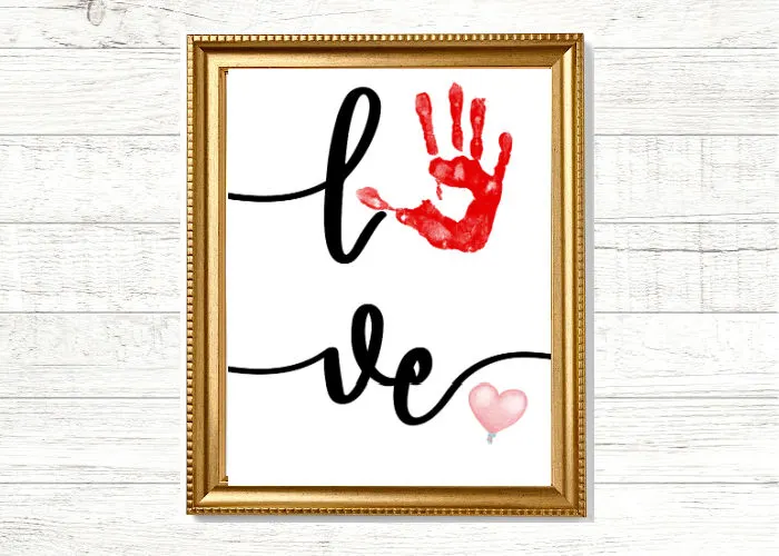 easy handprint craft for Valentines day that says love with handprint