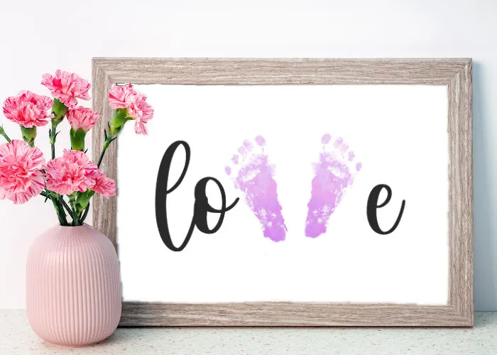 cute Valentine's day footprint craft with little feet spelling out LOVE