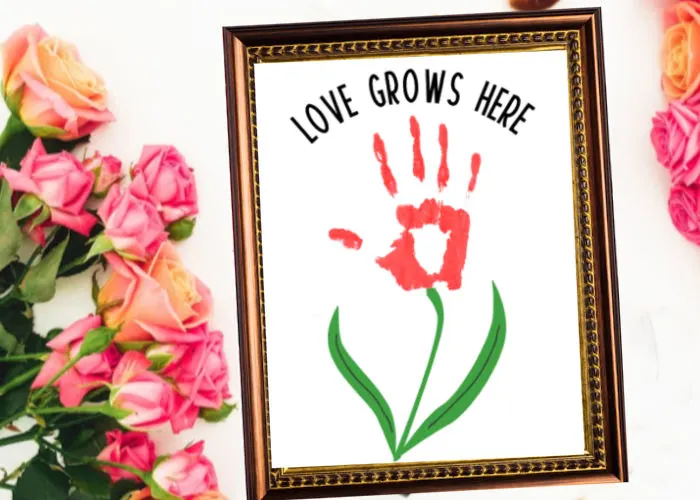 Love grows here handprint craft with handprint flower