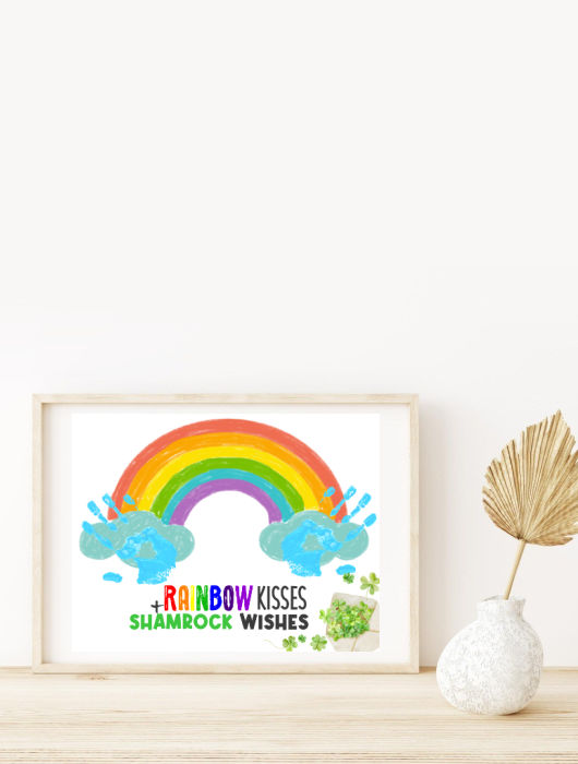 rainbow St. Patrick's Day handprint craft in picture frame on desk