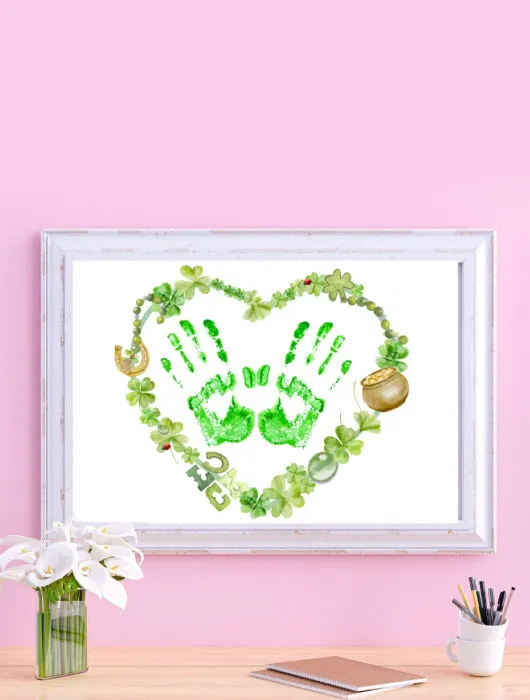 cute St. Patrick's day handprint heart craft for toddlers to make. handing on wall in frame