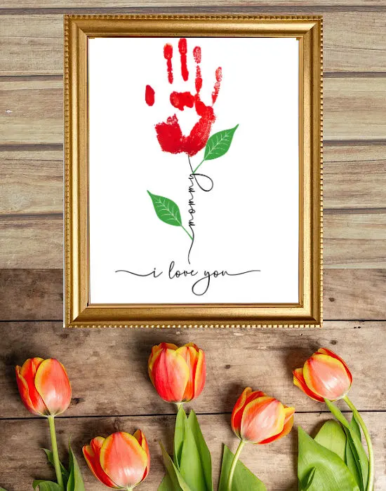 single flower stem with handprint for the flower and text that says mommy i love you