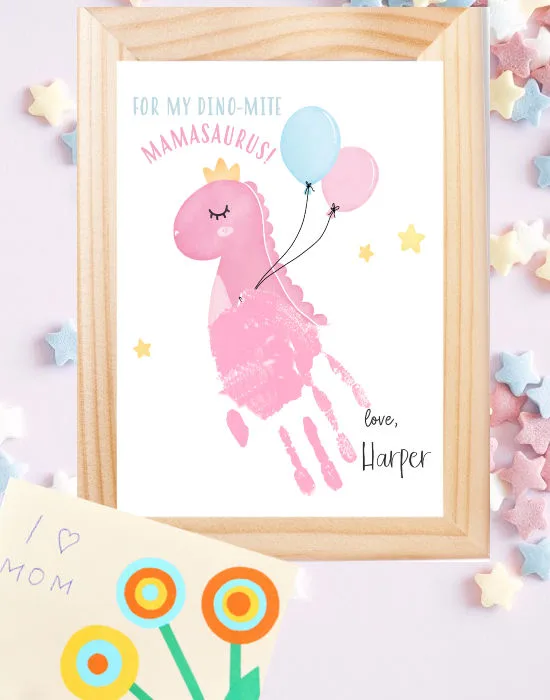 image of dinosur mother's day handprint craft in frame