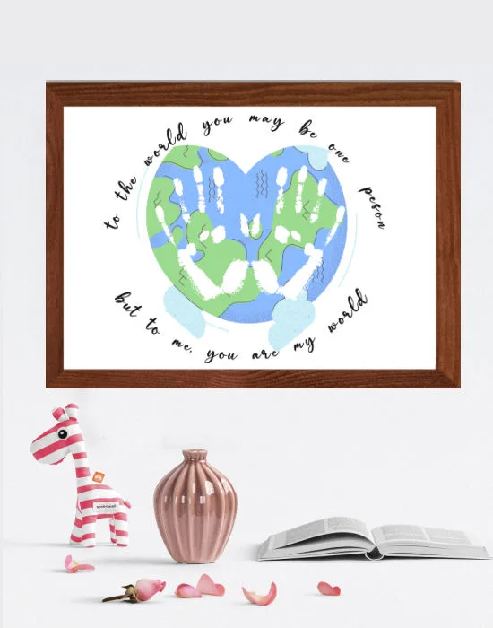 Mother's day handprint craft with image of earth with handprints on it in a frame