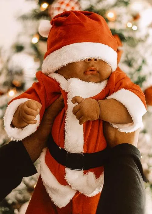 cute baby dressed in Santa costume 