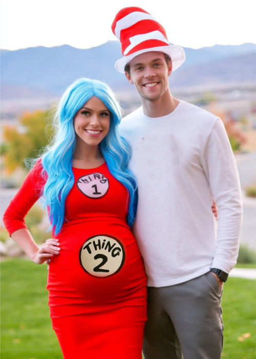a pregnant couple is dressed in Dr.Seus Themed costumes with thing 1 and thing 2 and husband is the cat in the hat.