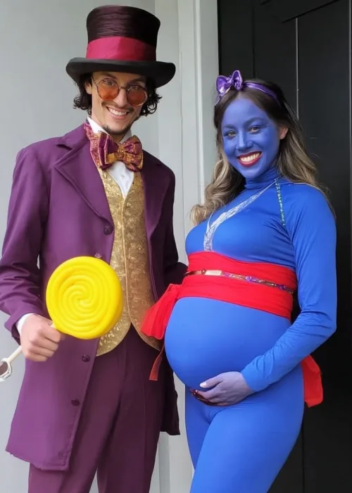 pregnant couple dressed in matching halloween costumes as willy wonka and violet blueberry girl