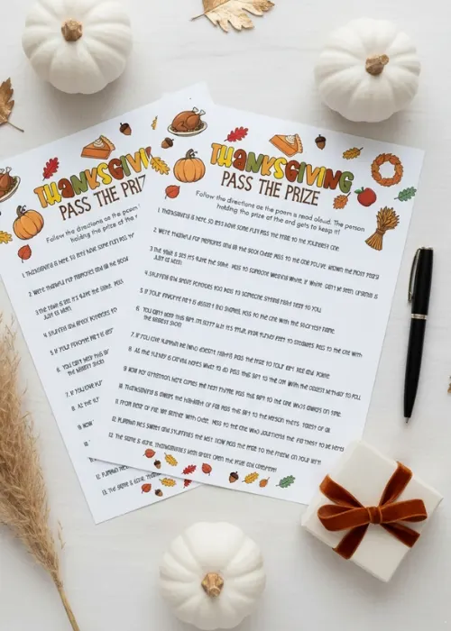 flat lay of Thanksgiving Pass the Gift Game with a little present and some mini pumpkins
