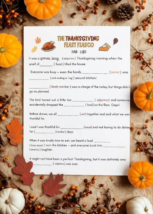 a flat lay of a printable Thanksgiving game: Thanksgiving Mad Libs
