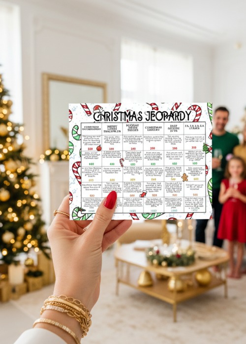 fun Christmas game ideas, woman's hand holding up Christmas jeopardy game