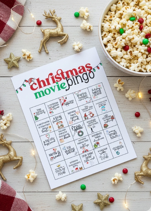 fun and cheesy Christmas movie bingo game flat lay with popcorn and holiday items