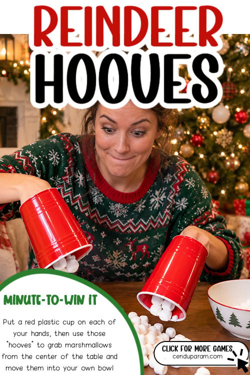 a woman wears plastic cups on her hands to scoop marshmallows for a hilarious Christmas game